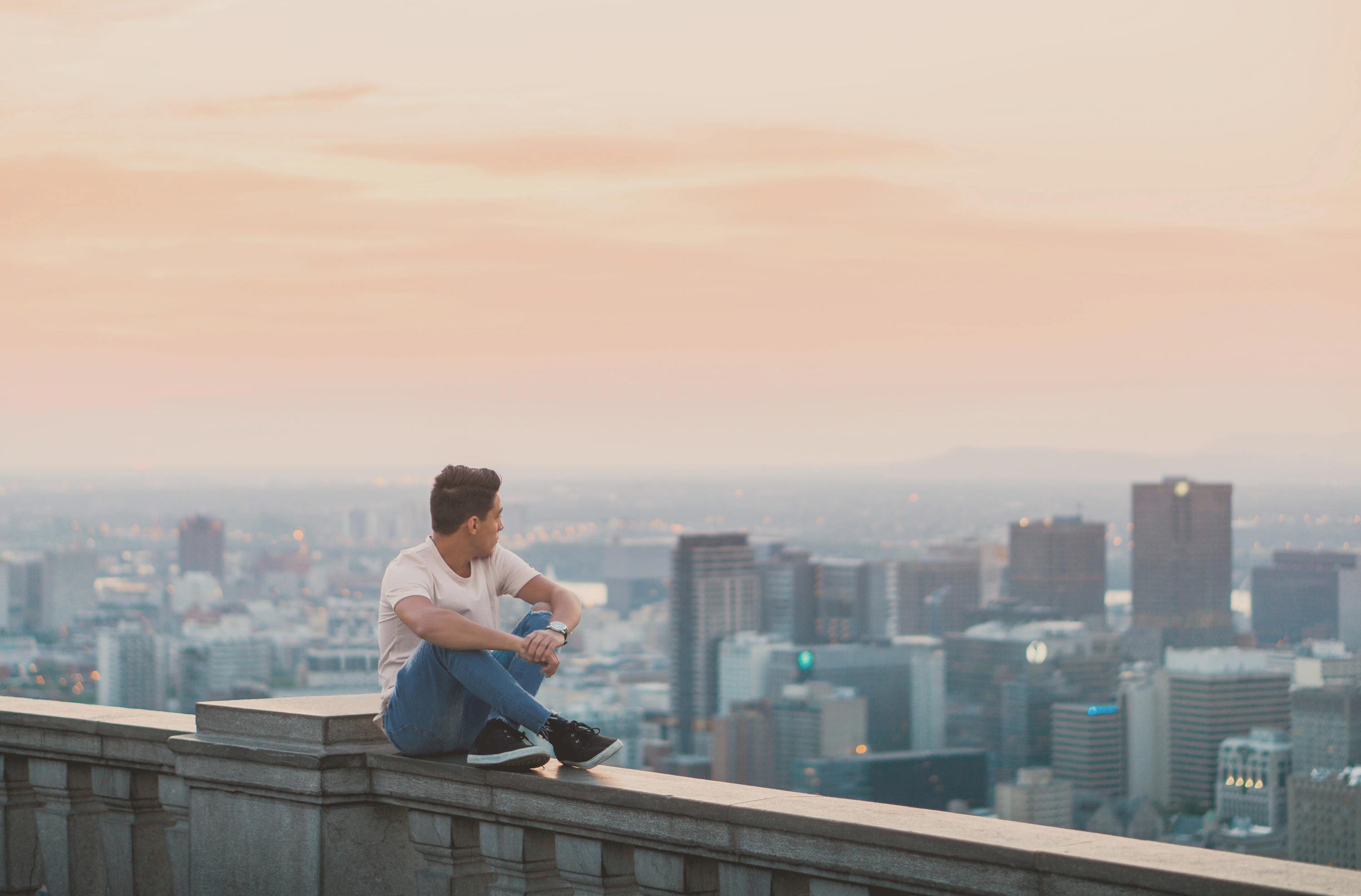 Man overlooking Montreal cityscape