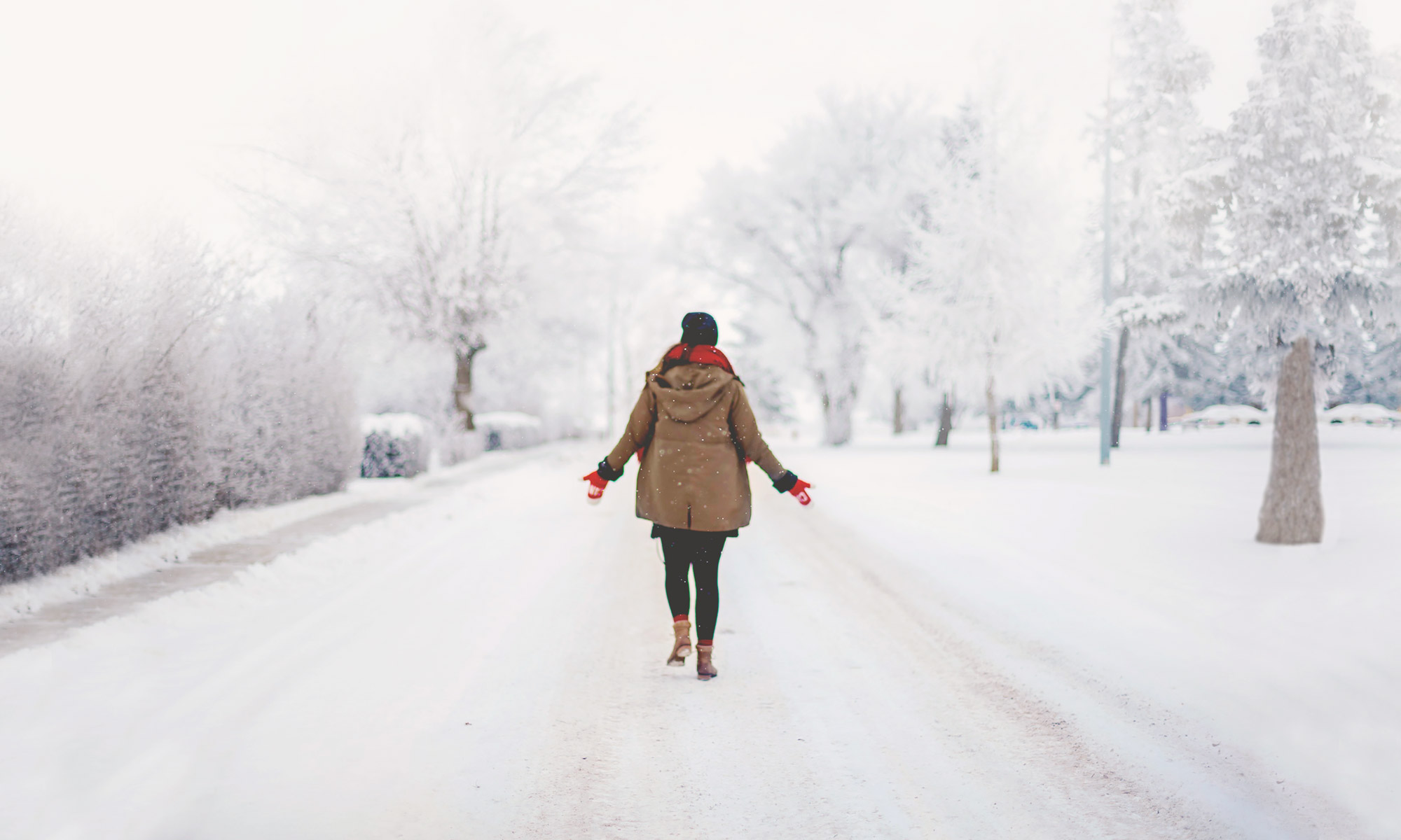 Woman walking on a snowy street